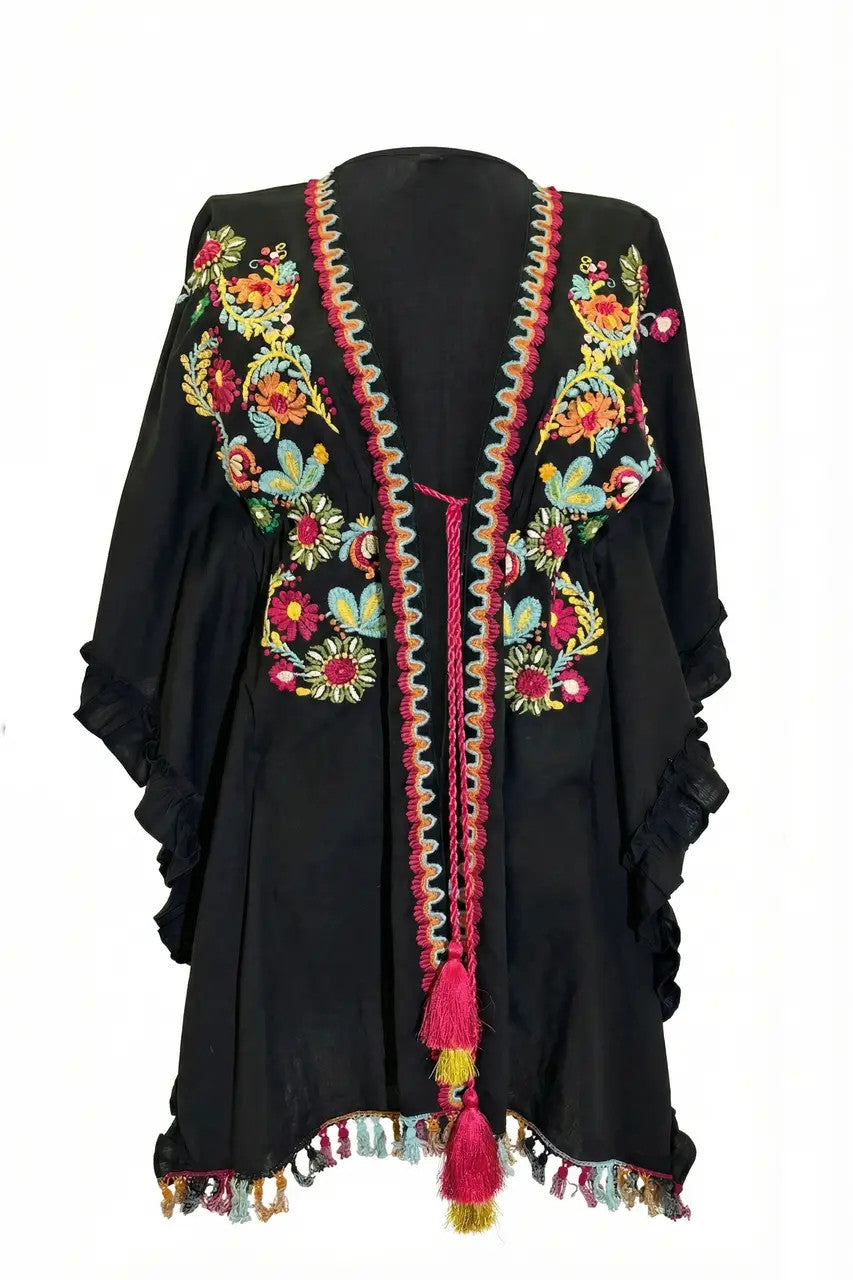 Poncho folk con ricami e nappine